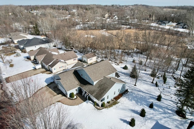 snowy aerial view featuring a residential view