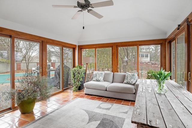 sunroom with vaulted ceiling, ceiling fan, and a wealth of natural light