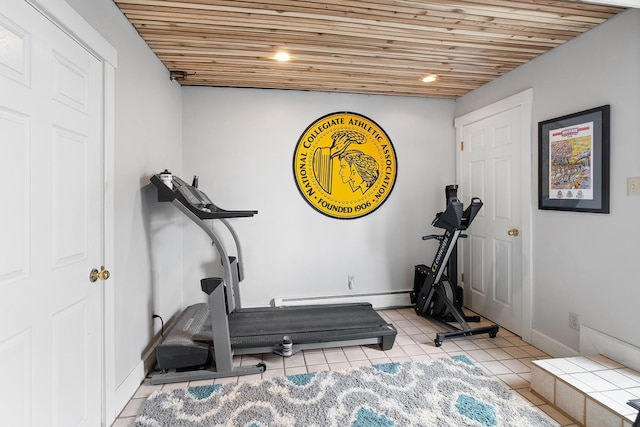 exercise area with wooden ceiling, baseboards, baseboard heating, and tile patterned floors