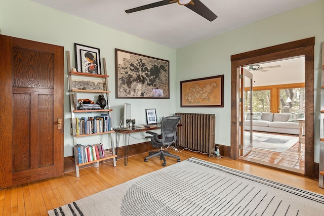 201 2nd St, Excelsior, MN 55331 - office space with ceiling fan, hardwood / wood-style floors, and radiator heating unit