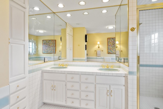 201 2nd St, Excelsior, MN 55331 - bathroom with a stall shower, recessed lighting, double vanity, and tile patterned flooring