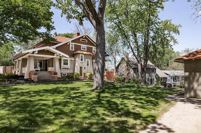 201 2nd St, Excelsior, MN 55331 - view of front facade with a chimney and a front lawn