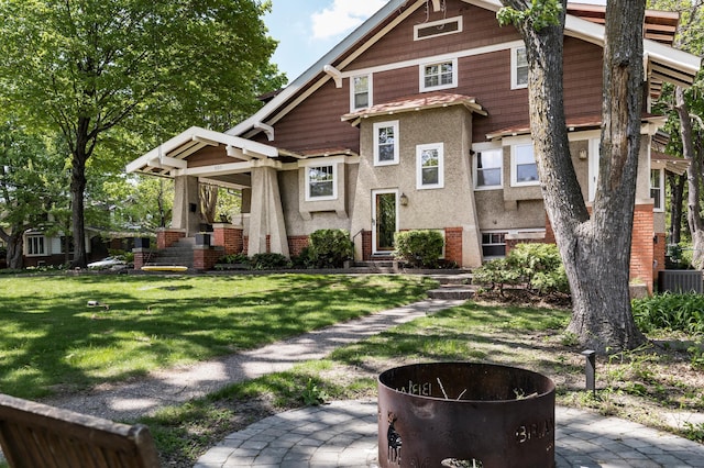 201 2nd St, Excelsior, MN 55331 - back of house featuring stucco siding, a yard, entry steps, and cooling unit