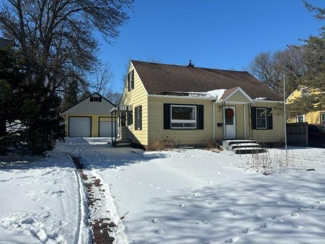 view of front of home with an outbuilding and a detached garage