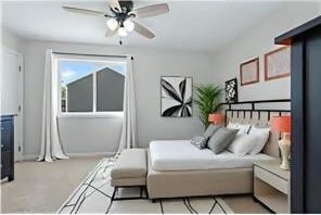 bedroom with baseboards and light carpet