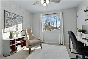 office space with a ceiling fan