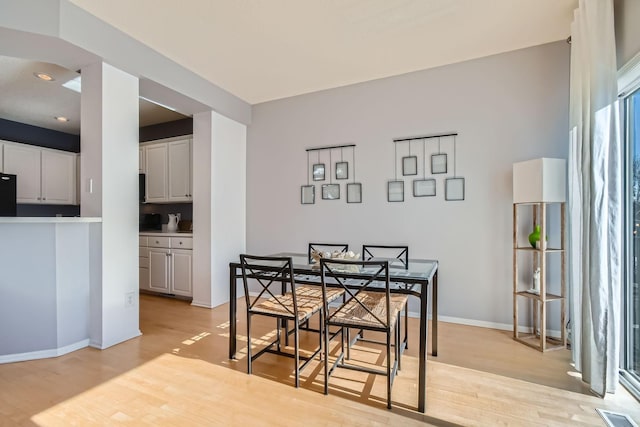 dining area with visible vents, recessed lighting, light wood-style flooring, and baseboards