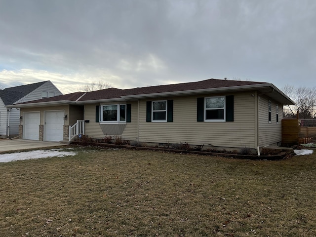 single story home featuring a garage, concrete driveway, and a front yard