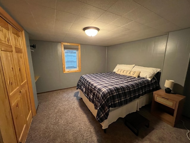 bedroom with dark carpet