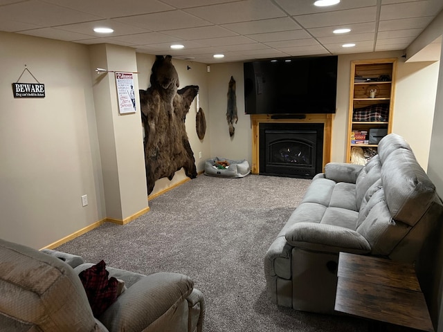 carpeted living area featuring recessed lighting, a fireplace, a paneled ceiling, and baseboards