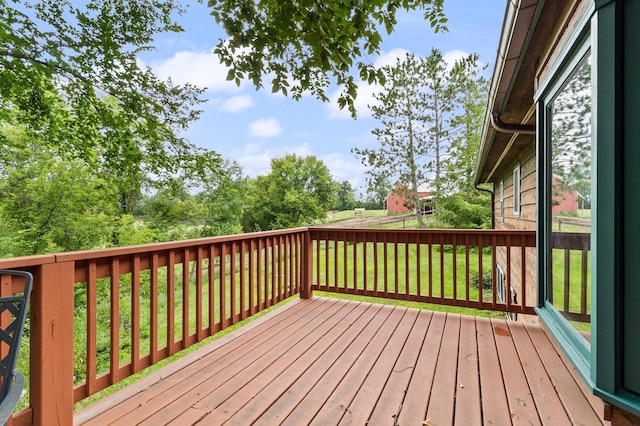 wooden deck with a lawn