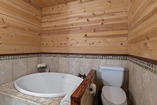 full bathroom with a freestanding bath and toilet