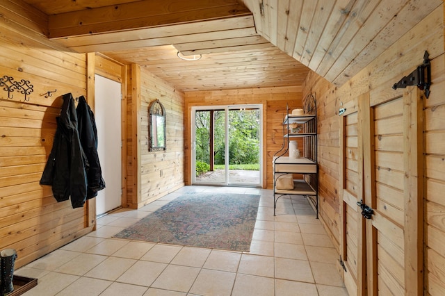 entryway with wood ceiling, wooden walls, and light tile patterned flooring