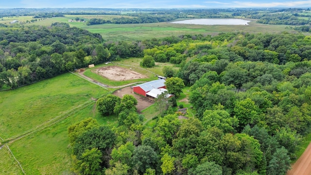 drone / aerial view featuring a forest view and a rural view