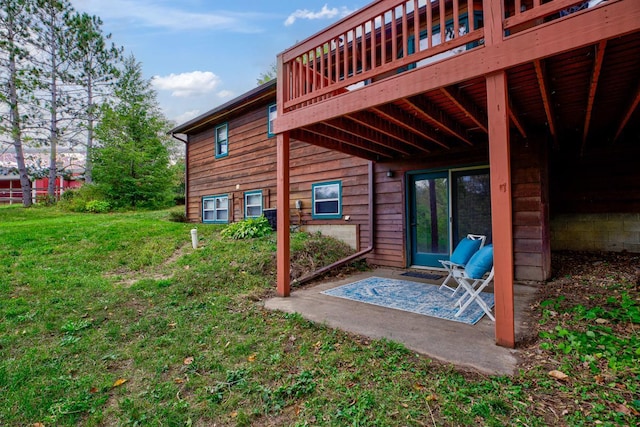 view of yard with a deck and a patio