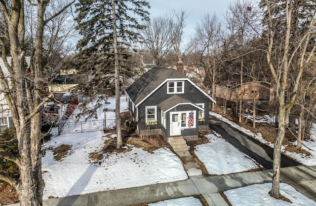 view of front of house with roof with shingles