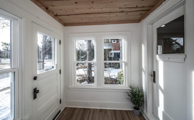 entryway with wooden ceiling, plenty of natural light, baseboards, and dark wood-type flooring