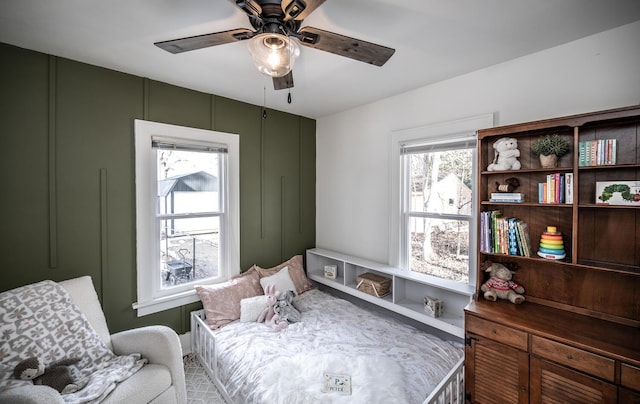 living area featuring a ceiling fan