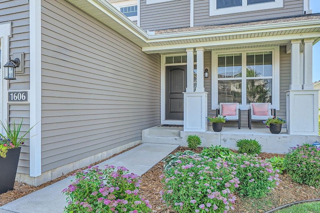 property entrance featuring covered porch