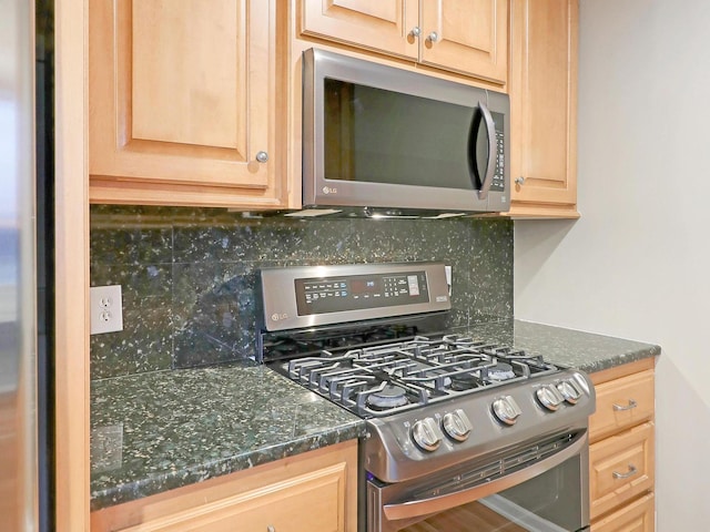 kitchen featuring backsplash, appliances with stainless steel finishes, and light brown cabinets