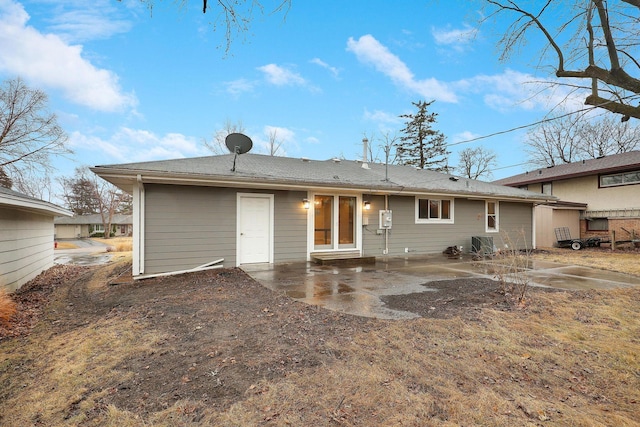 rear view of property with a patio area and cooling unit