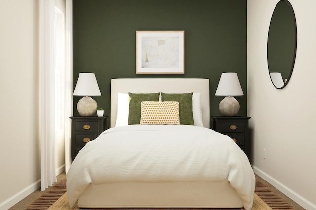 bedroom with carpet flooring and baseboards