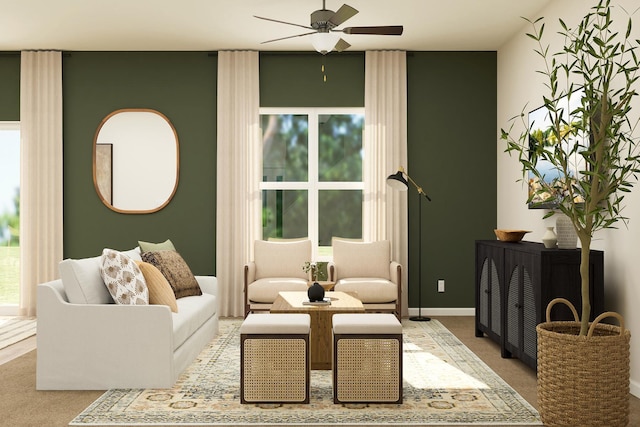 carpeted living area featuring baseboards and a ceiling fan