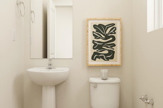 bathroom featuring a sink and toilet