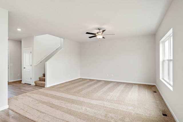 10097 Twin Lakes Pkwy NW, Elk River, MN 55330 - unfurnished room with stairway, a ceiling fan, recessed lighting, and carpet flooring
