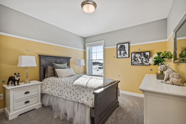 bedroom featuring light colored carpet and baseboards