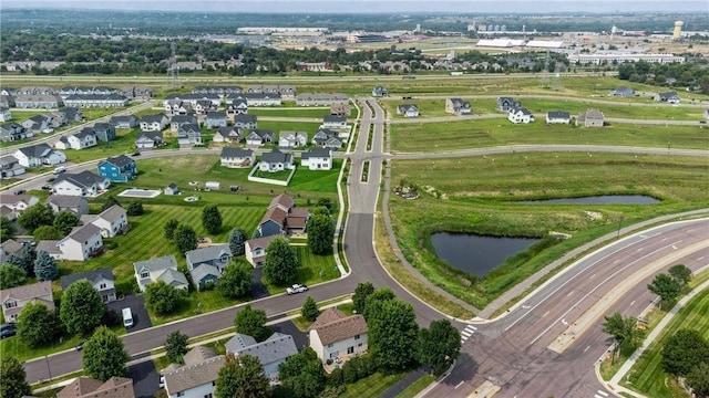 bird's eye view with a water view and a residential view