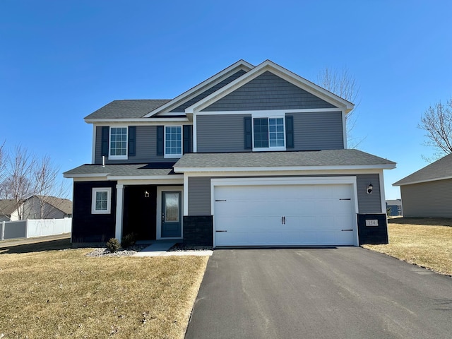 154 Summerfield Dr, Waverly, MN 55390 - view of front facade with a front lawn, fence, a garage, and aphalt driveway