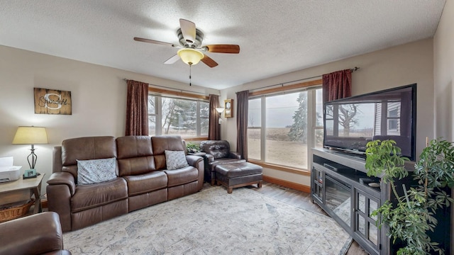 38184 County 47th Blvd, Goodhue, MN 55027 - living area featuring ceiling fan, light wood-type flooring, and a textured ceiling