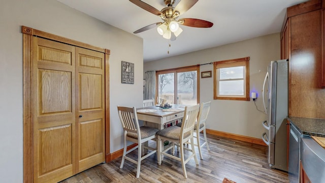 38184 County 47th Blvd, Goodhue, MN 55027 - dining area with light wood-style flooring, ceiling fan, and baseboards
