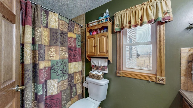 38184 County 47th Blvd, Goodhue, MN 55027 - full bath with toilet, a shower with curtain, and a textured ceiling