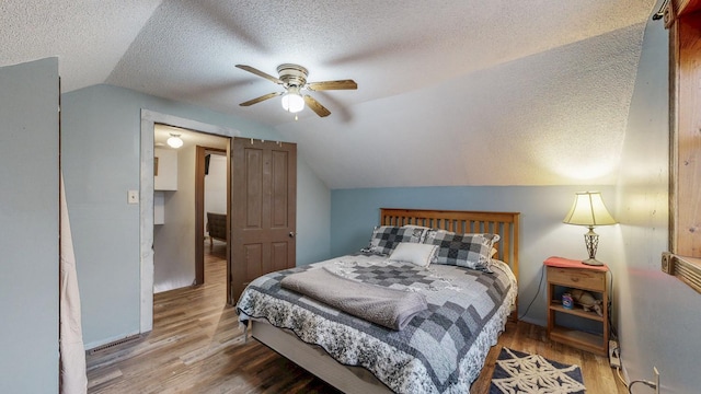 38184 County 47th Blvd, Goodhue, MN 55027 - bedroom featuring lofted ceiling, a textured ceiling, wood finished floors, and ceiling fan