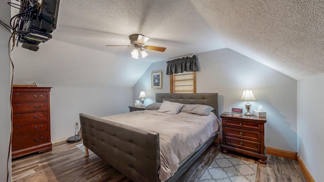 38184 County 47th Blvd, Goodhue, MN 55027 - bedroom featuring wood finished floors, baseboards, vaulted ceiling, a textured ceiling, and ceiling fan