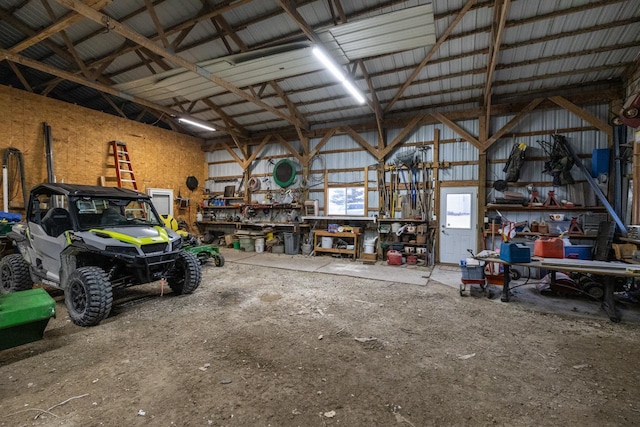 38184 County 47th Blvd, Goodhue, MN 55027 - garage featuring metal wall and a workshop area