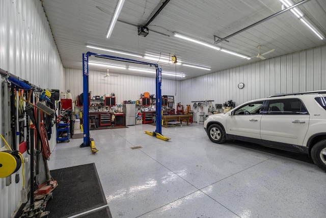 38184 County 47th Blvd, Goodhue, MN 55027 - garage featuring a garage door opener and a workshop area