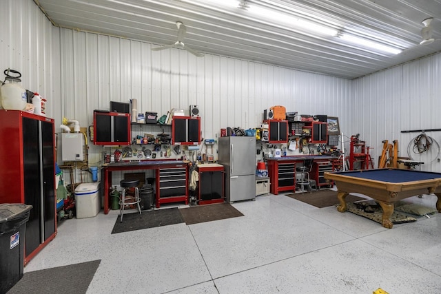 38184 County 47th Blvd, Goodhue, MN 55027 - garage featuring a workshop area, freestanding refrigerator, and ceiling fan