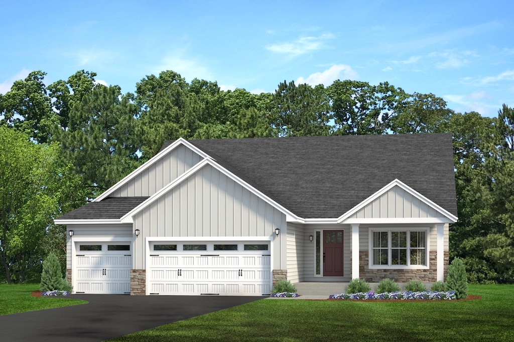 view of front of home with a shingled roof, stone siding, aphalt driveway, an attached garage, and board and batten siding