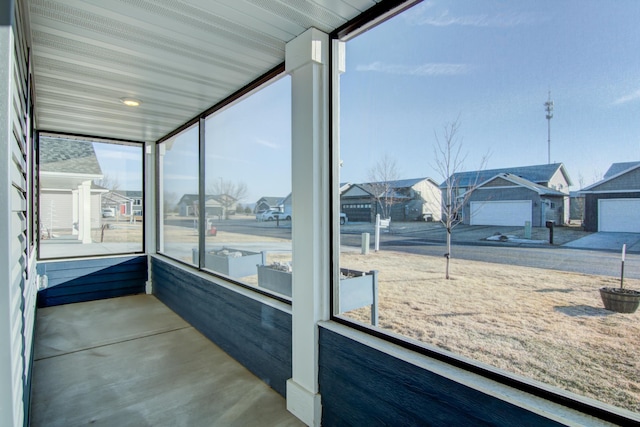 sunroom featuring a residential view