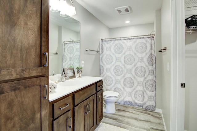 full bathroom featuring toilet and vanity