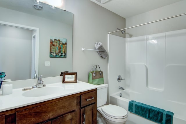 full bath with toilet,  shower combination, and vanity