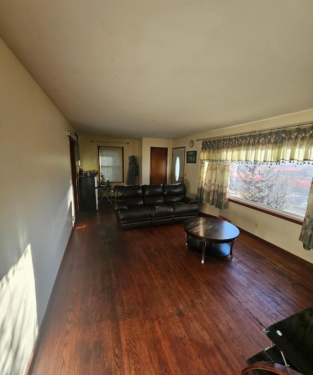 unfurnished living room with wood finished floors