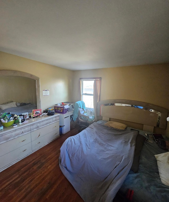 bedroom featuring dark wood-type flooring