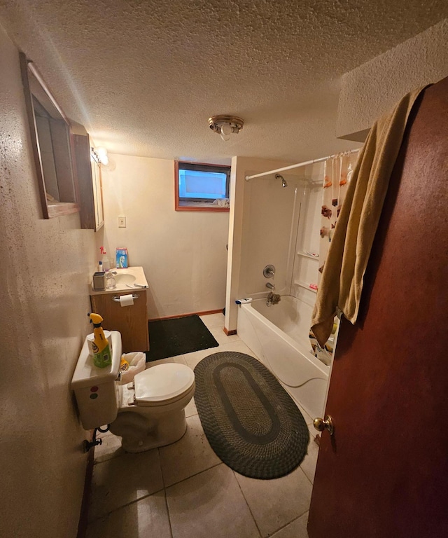 bathroom with a textured ceiling, toilet, shower / bath combination, and vanity