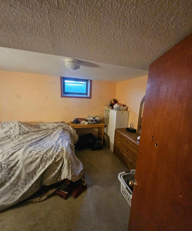 carpeted bedroom featuring a textured ceiling