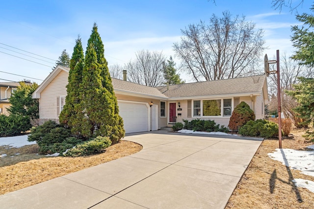 ranch-style house with an attached garage and concrete driveway