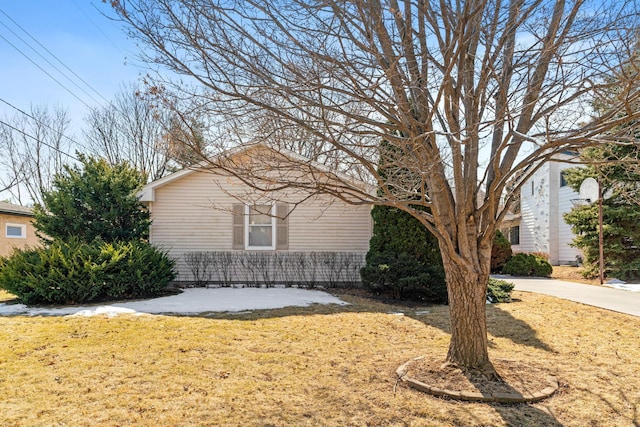 view of home's exterior with a lawn